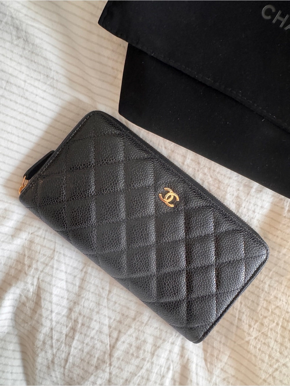 CHANEL Black Quilted Zip-Around Wallet with Gold CC